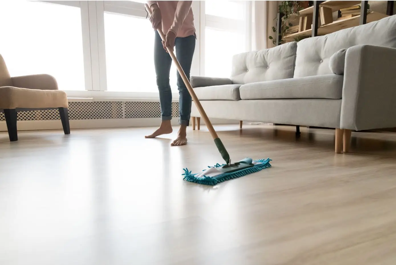 barefoot woman mopping floors