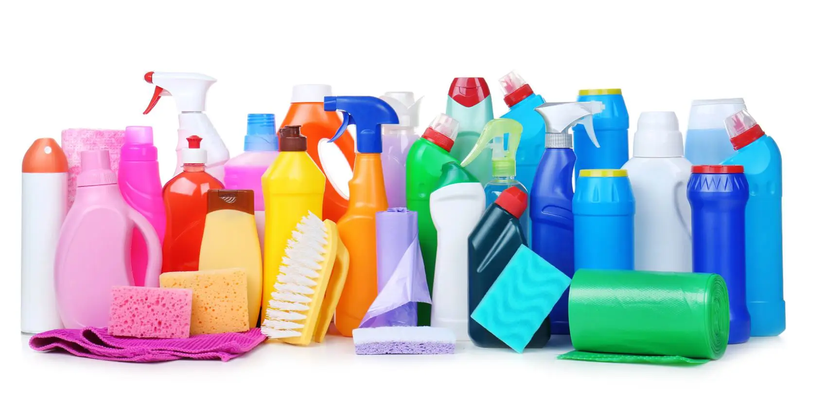 bottles of assorted different coloured cleaning chemicals on a flat desk