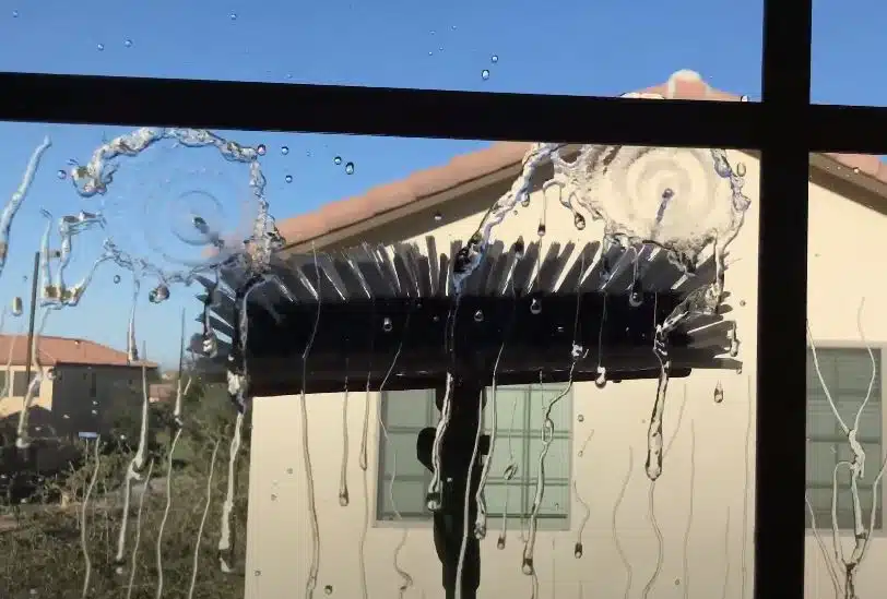 Exterior window cleaning with a pole squeegee