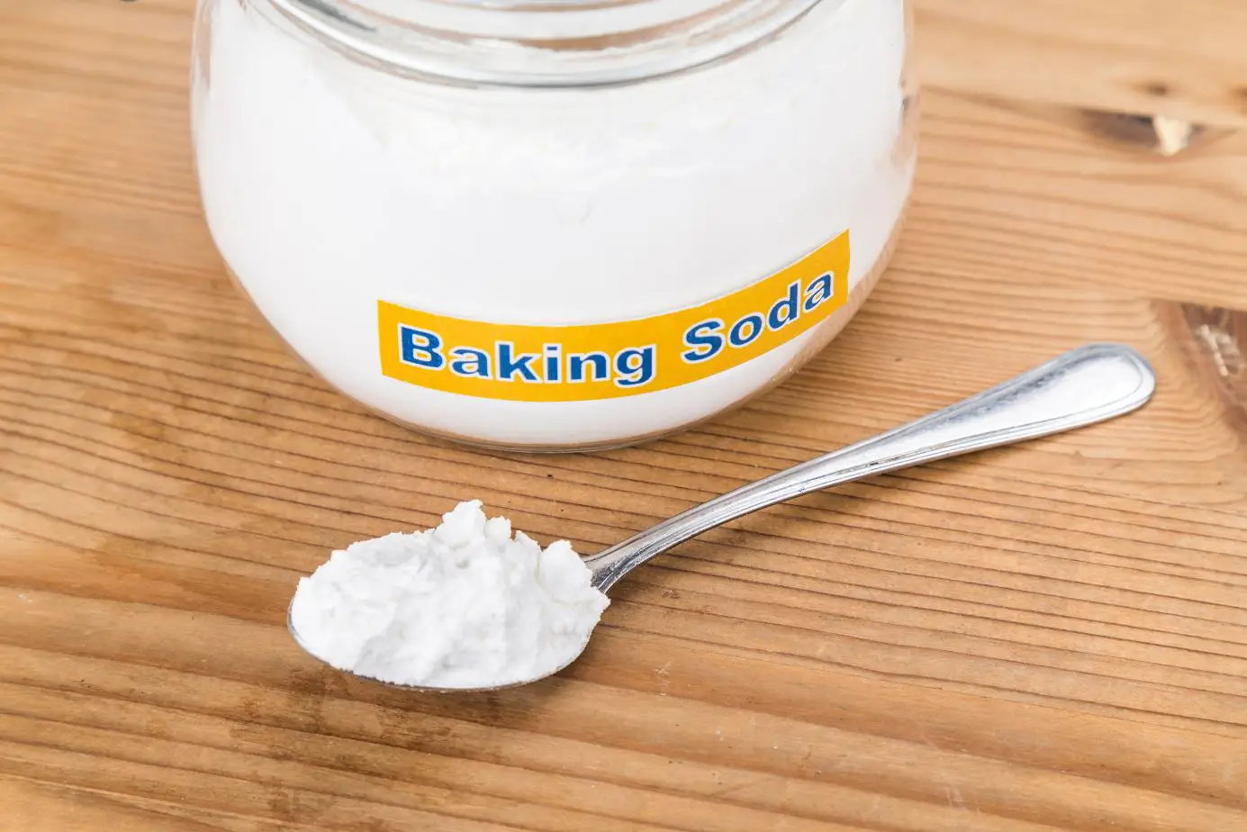 jar and spoon full of baking soda