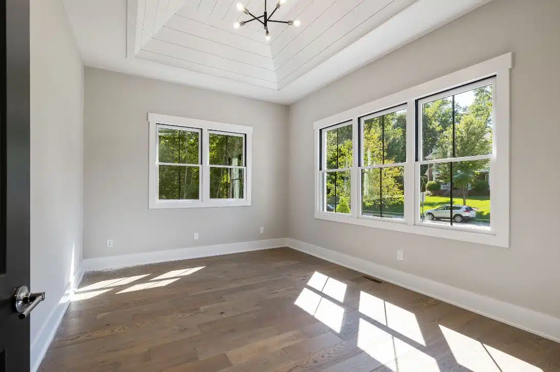 large empty bedroom with engineered timber floorboards