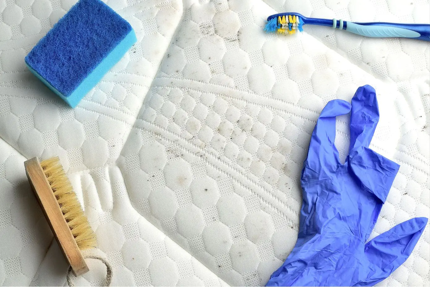 mattress cleaning equipment on a dirty white mattress