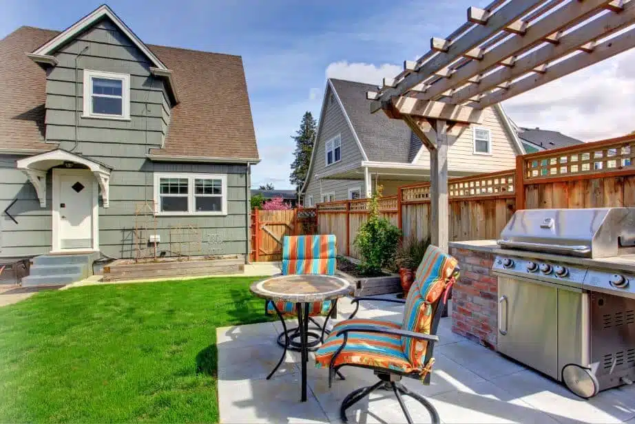 modern outdoor area with colourful furniture and a large BBQ