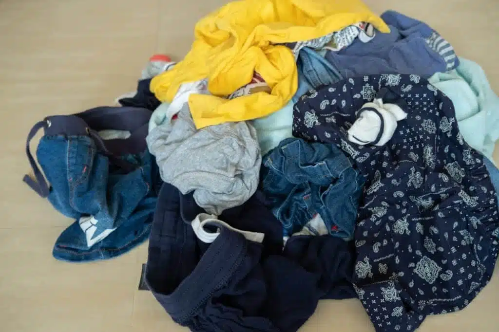 A photo of laundry on a wooden floor