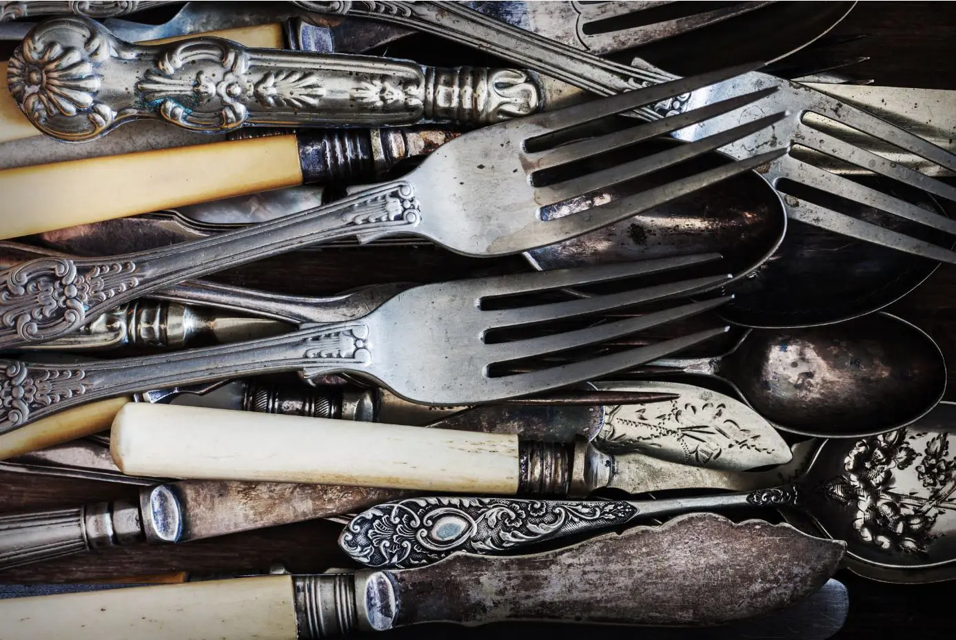 silver cutlery that has been tarnished