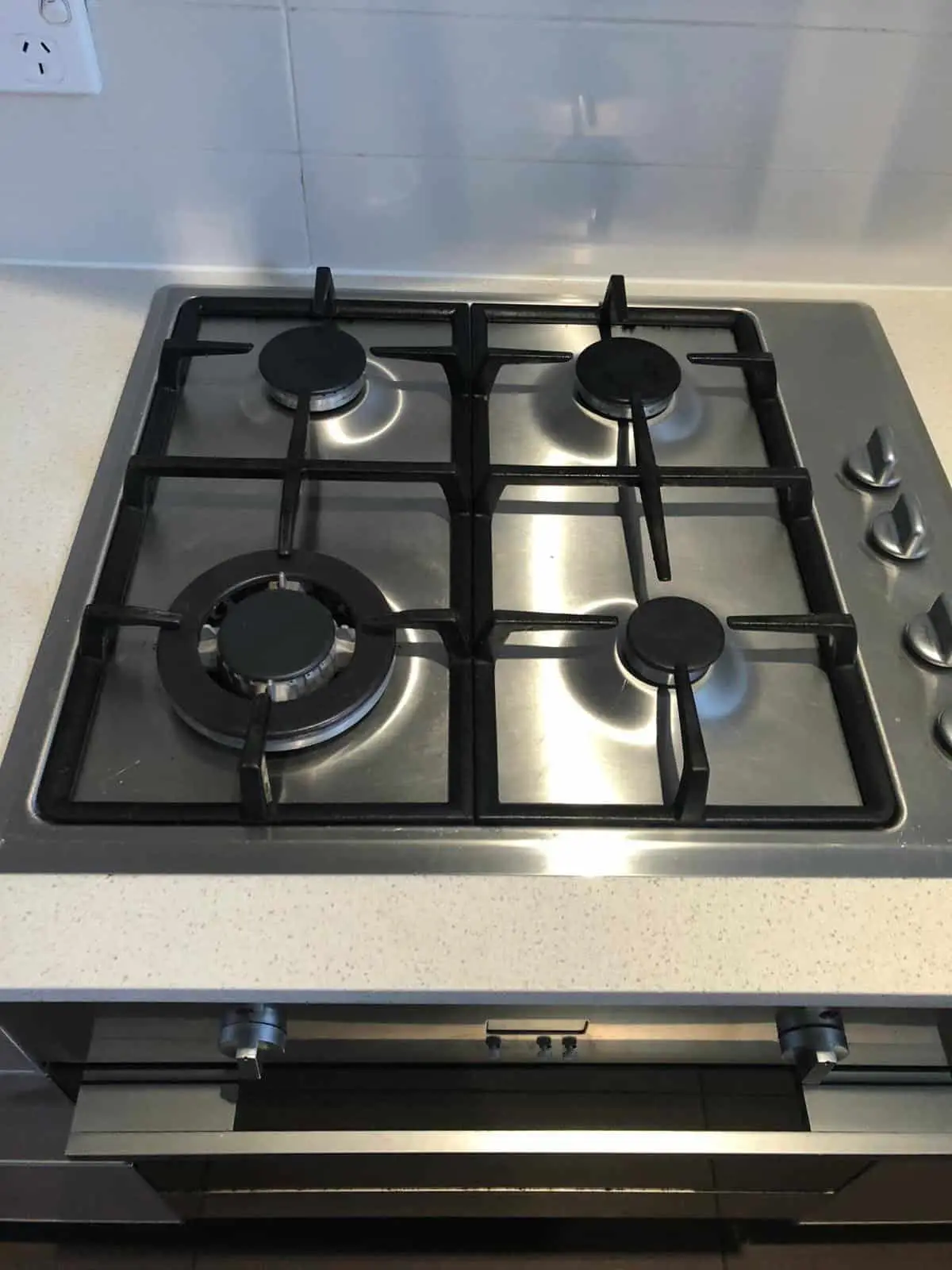 stainless steel cook top with cleaned stove knobs
