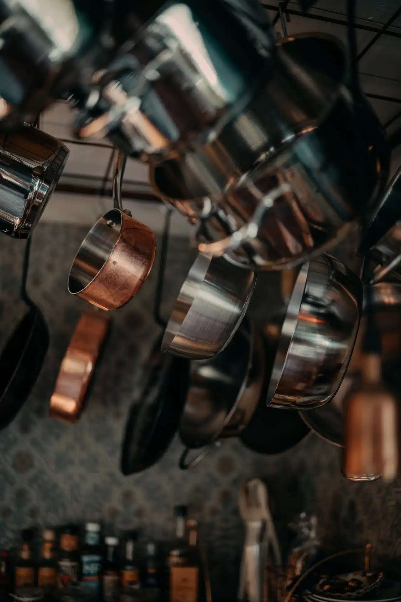 Stainless Steel pots and pans hanging in a kitchen